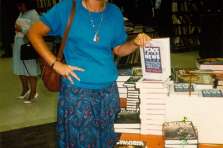 Mills poses with her first book, A Place in the News, at Dutton’s Bookstore in LA, July 1988.
