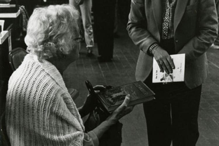 Lucile Morris Upton with a copy of her book, Bald Knobbers, at the Southwest Missouri State University