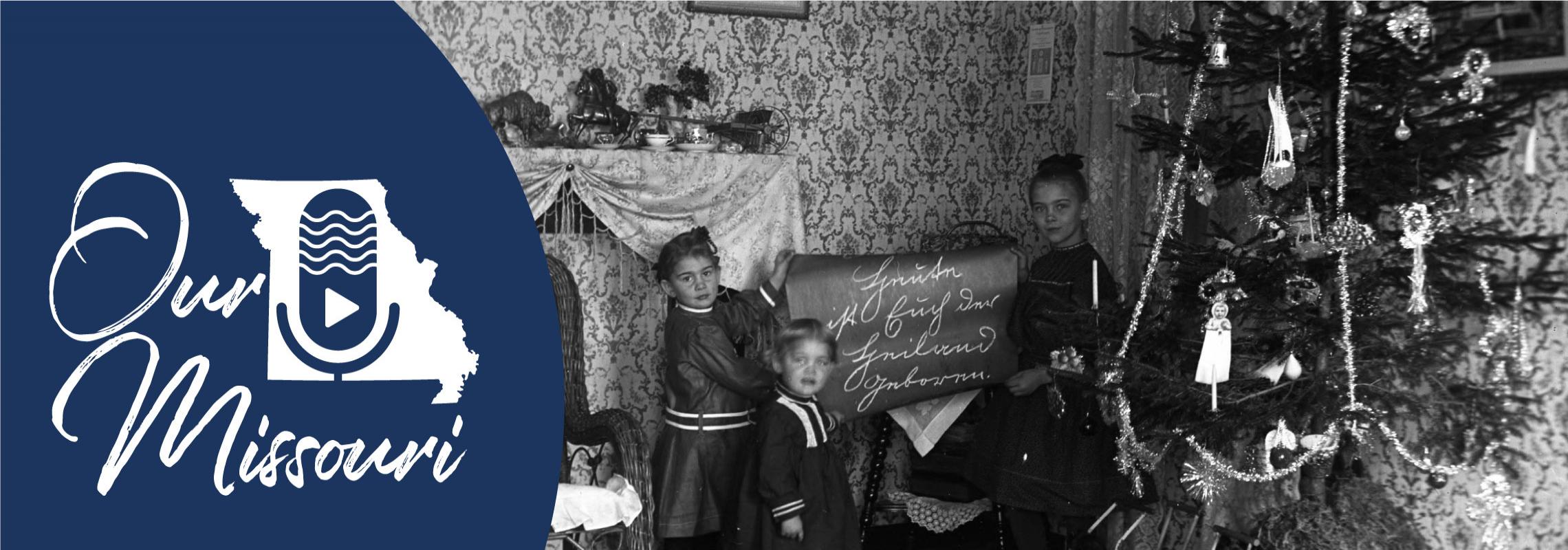 Kemper girls holding Christmas banner translated as "Today the Savior is born to you." [Edward J. Kemper Collection (C4388)]