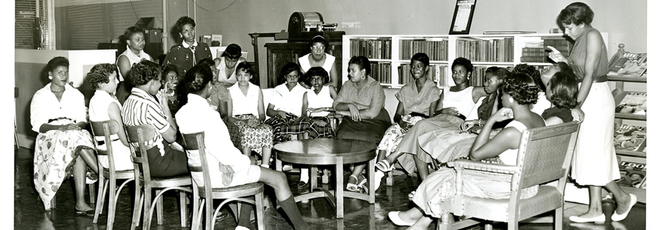 22 African American women sitting around a table