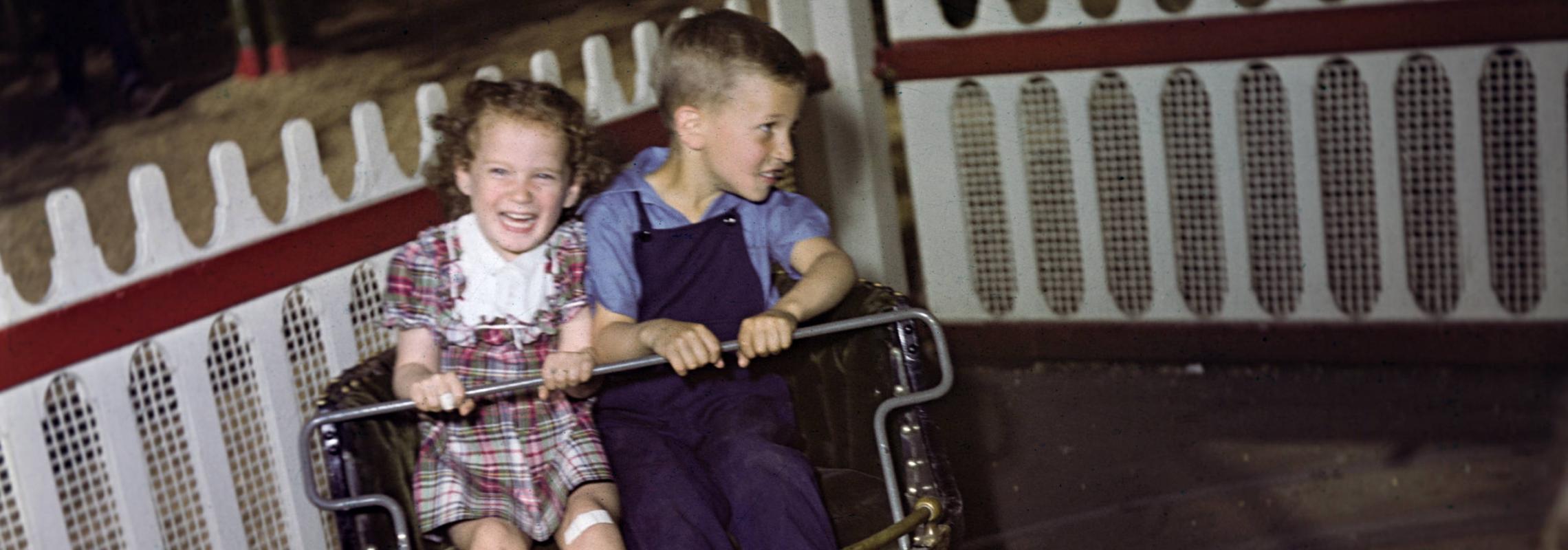 Kids on amusement park ride