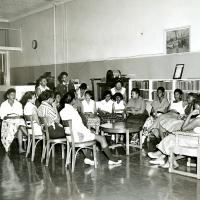 22 African American women sitting around a table