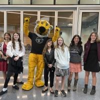 Truman the Tiger poses with NHD students at the Center for Missouri Studies on April 22, 2023
